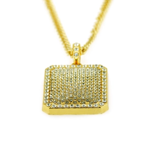 Detailed macro view of gold square pendant featuring dense pavé crystal settings and chain