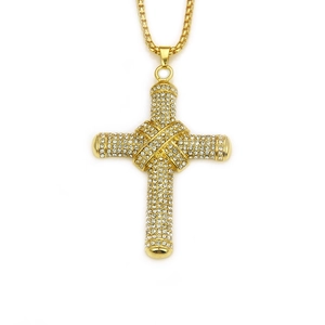 Close-up of a gold-plated iced-out cross pendant with sparkling crystals on a box chain