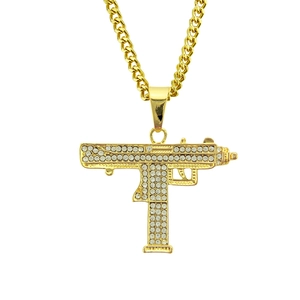 Hip hop gold Uzi pendant necklace with shiny rhinestones on a thick cuban chain