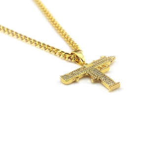 Gold UZI submachine gun pendant necklace with rhinestones on a Cuban link chain