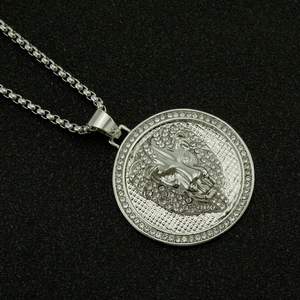 Macro shot of silver lion head pendant with sparkling rhinestones and metal link chain