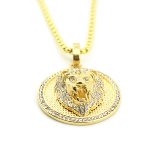 Close-up of golden lion head pendant featuring sparkling white zircon encrusted frame