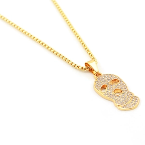 Collier hip hop pour hommes avec pendentif tête de mort doré et strass brillants