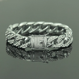 Hip hop silver Cuban link bracelet with iced out micro-pave rhinestones on dark grey surface