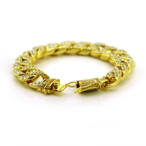 Close-up of iced out Cuban link bracelet with gold plating and sparkling crystals