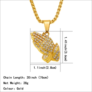 Iced out gold praying hands pendant with full crystals on a long round box chain