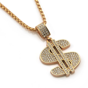 Macro shot of hip hop dollar sign pendant with white rhinestones on gold box chain