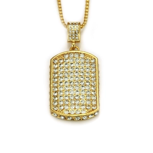 Detailed macro view of hip hop dog tag pendant with sparkling cubic zirconia pavé