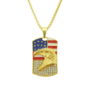 Golden American flag necklace featuring eagle pendant with sparkling crystals and box chain