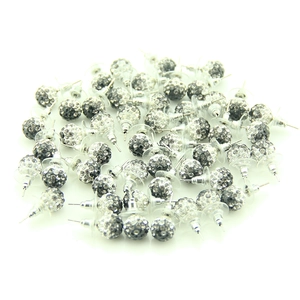 Close-up of sparkling rhinestone ball stud earrings in silver and dark grey tones