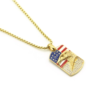 Detailed close-up of golden eagle pendant with US flag enamel and crystal stones