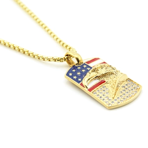 Detail of hip hop dog tag necklace with golden eagle, American flag and crystals