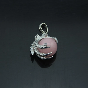 Gothic dragon claw necklace featuring a spinning natural pink quartz stone pendant
