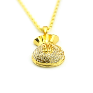 Detailed close-up of a hip hop dollar sign money bag pendant with iced-out rhinestones