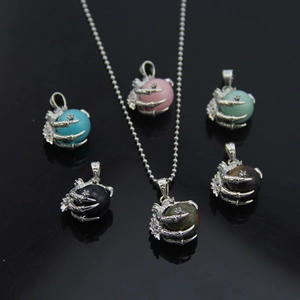 Dragon claw necklace with rotatable natural stones including turquoise and tiger eye