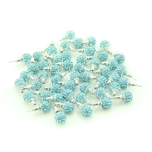 Detailed close-up of light blue crystal ball stud earrings with silver metal pins