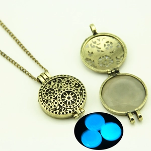 Detail of steampunk hollow pendant with gear pattern and blue luminous glow effect
