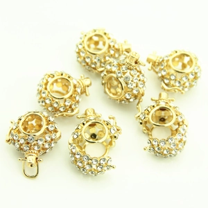 Golden hollow sphere charms with rhinestones for DIY necklace making in a multi-pack layout