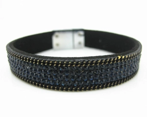 Detail of four-row blue rhinestone bracelet with velvet strap and magnetic clasp