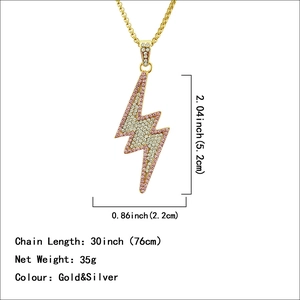 Iced out pink and white rhinestone lightning bolt pendant with golden chain