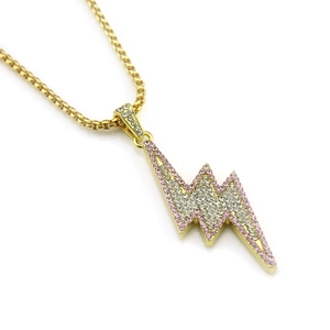 Close-up of hip hop lightning pendant with pink and clear zircons on gold chain