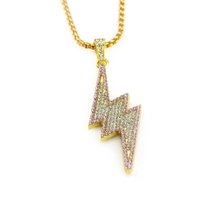 Detail of hip hop lightning bolt pendant with pink and clear crystals on gold chain