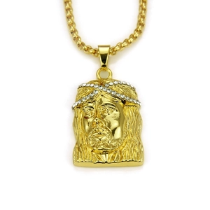 Detailed view of gold Jesus piece pendant with sparkling crystal thorn crown