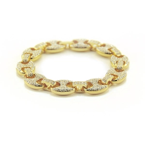 Hip hop gold bracelet with iced-out pig nose links and pave set rhinestones on white base