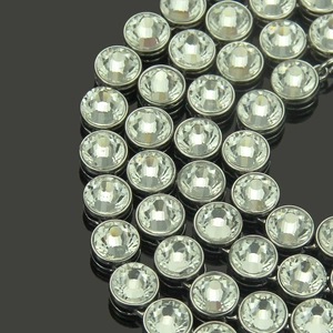 Macro detail of luxury iced out hip hop chain with clear crystals in silver setting