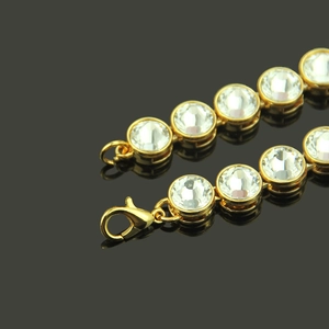 Hip hop gold tennis necklace with large round crystals and lobster clasp on black background