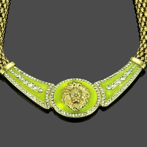 Golden chunky chain necklace with lion head pendant and green enamel inlays