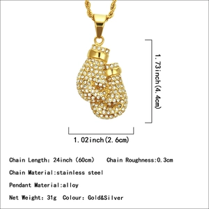 Iced out boxing glove pendant on a 24-inch stainless steel chain in gold finish