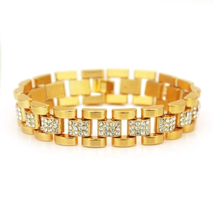 Detail of gold watch-band style bracelet with square 3x3 white crystal settings