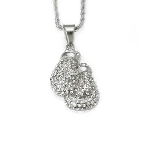 Macro detail of iced-out silver boxing gloves pendant with sparkling white rhinestones