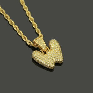 Macro shot of hip hop letter W pendant with micro-pave cubic zirconia on rope chain