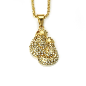 Detail of gold-plated boxing glove pendant with crystal micro-pave and rope chain