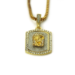 Detail of 18K gold-plated hip hop pendant with Jesus relief and sparkling zircons
