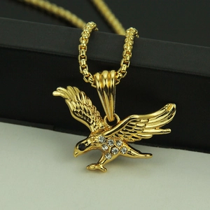 Hip hop gold eagle pendant necklace with sparkling crystals on a box chain