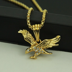 Hip hop 18K gold plated eagle pendant necklace with white zircons on a jewelry box