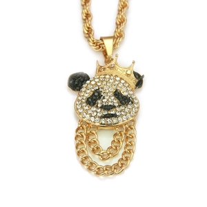 Macro view of iced-out panda pendant with crown and gold twisted rope chain details