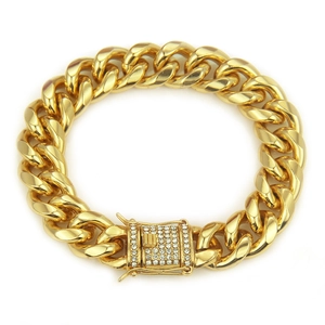 Detailed view of gold Cuban chain bracelet featuring a diamond-studded box clasp