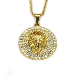 Close-up of gold lion head pendant with micro-paved rhinestones and twisted rope chain