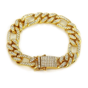 Detailed macro of a 12mm gold Cuban link bracelet featuring a rhinestone box clasp