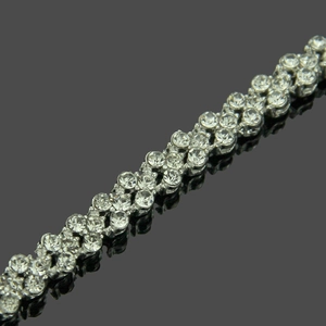 Elegant multi-row rhinestone bracelet in silver-tone alloy with shimmering wavy crystal pave