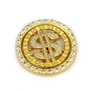 Close-up of a rotating gold dollar sign pendant with sparkling rhinestones for DIY phone cases