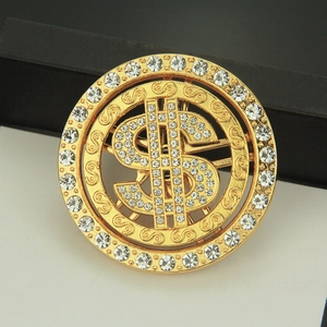 Golden spinning dollar sign pendant with sparkling rhinestones in a circular design