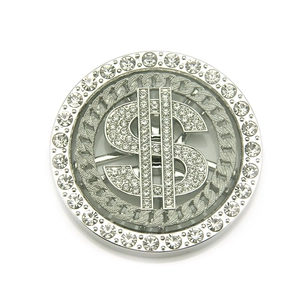 Close-up of a silver spinning dollar sign charm with sparkling rhinestones for DIY phone cases
