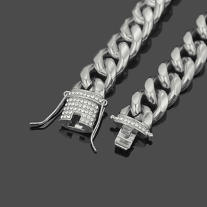 Men's silver Cuban link bracelet with diamond-encrusted box clasp in hip-hop street style