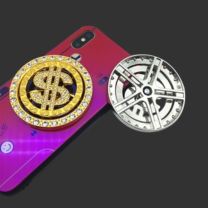 Detail showing rotatable dollar sign metal phone stand with sparkling rhinestones decoration
