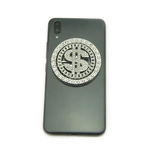 Silver metal phone socket grip with sparkling rhinestone crystals and dollar sign icon